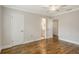 Bedroom with hardwood floors and access to bathroom at 2325 Riverbluff Pkwy # V247, Sarasota, FL 34231