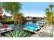 Scenic canal views with private boat docks and lush tropical landscaping at 2325 Riverbluff Pkwy # V247, Sarasota, FL 34231