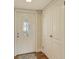 Front entry with white door and built-in closets at 2325 Riverbluff Pkwy # V247, Sarasota, FL 34231