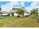 White single story home with carport and landscaped lawn at 2325 Riverbluff Pkwy # V247, Sarasota, FL 34231
