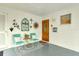 Front entry with teal chairs and southwestern decor at 2325 Riverbluff Pkwy # V247, Sarasota, FL 34231