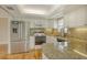 Updated kitchen with stainless steel appliances and granite countertops at 2325 Riverbluff Pkwy # V247, Sarasota, FL 34231