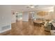 Open living room and kitchen with wood floors at 2325 Riverbluff Pkwy # V247, Sarasota, FL 34231