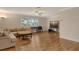 Living room with sectional sofa and TV at 2325 Riverbluff Pkwy # V247, Sarasota, FL 34231