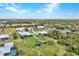 An aerial view showcasing a luxurious home with a pool and expansive backyard in a peaceful waterfront community at 28976 Smugglers Ln, Punta Gorda, FL 33982