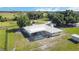 Aerial view of the home, pool, and surrounding land at 33931 Serene Dr, Punta Gorda, FL 33982