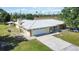 Aerial view of the property showcasing the house and land at 33931 Serene Dr, Punta Gorda, FL 33982
