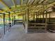Rustic animal shelter with multiple stalls and concrete floor at 33931 Serene Dr, Punta Gorda, FL 33982