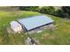 Aerial view of a large covered animal shelter and adjacent smaller shed at 33931 Serene Dr, Punta Gorda, FL 33982