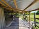 Interior view of an open-air animal shelter with wooden stalls at 33931 Serene Dr, Punta Gorda, FL 33982