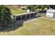 Covered animal shelter with multiple stalls and a water tank at 33931 Serene Dr, Punta Gorda, FL 33982
