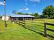 Exterior view of a rustic animal shelter with wooden fencing at 33931 Serene Dr, Punta Gorda, FL 33982