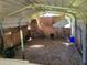 Chicken coop with dirt floor and wire mesh walls at 33931 Serene Dr, Punta Gorda, FL 33982
