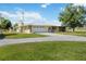 Ranch-style home with a metal roof and large yard at 33931 Serene Dr, Punta Gorda, FL 33982