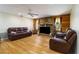 Living room with stone fireplace and leather couches at 33931 Serene Dr, Punta Gorda, FL 33982
