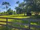 Spacious pasture with wooden fencing at 33931 Serene Dr, Punta Gorda, FL 33982