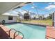 Inviting screened-in pool with open backyard views at 33931 Serene Dr, Punta Gorda, FL 33982