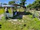 Silver horse trailer parked under a metal carport at 33931 Serene Dr, Punta Gorda, FL 33982