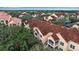 Aerial view of condo building with Spanish tile roofs at 4122 Central Sarasota Pkwy # 1914, Sarasota, FL 34238