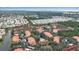 Aerial view showing community with pool, lake, and surrounding landscape at 4122 Central Sarasota Pkwy # 1914, Sarasota, FL 34238