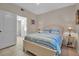 Well-lit bedroom with a double bed and adjacent bathroom at 4122 Central Sarasota Pkwy # 1914, Sarasota, FL 34238