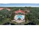 Aerial view of community pool with surrounding landscaping at 4122 Central Sarasota Pkwy # 1914, Sarasota, FL 34238
