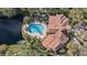 Community pool with surrounding deck and lush landscaping at 4122 Central Sarasota Pkwy # 1914, Sarasota, FL 34238