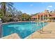 Resort-style pool with spacious deck and lounge chairs at 4122 Central Sarasota Pkwy # 1914, Sarasota, FL 34238