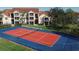 Community tennis court with blue and red surface at 4122 Central Sarasota Pkwy # 1914, Sarasota, FL 34238