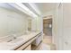 Clean bathroom with double vanity, walk-in shower, and ample storage at 4366 Madeira Ct # 3356, Sarasota, FL 34233