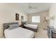 Guest bedroom with two twin beds and ceiling fan at 4366 Madeira Ct # 3356, Sarasota, FL 34233
