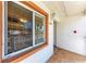 Condo entry with a light brown door and tiled flooring at 4366 Madeira Ct # 3356, Sarasota, FL 34233