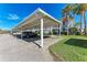 Condo building with covered parking and tropical landscaping at 4366 Madeira Ct # 3356, Sarasota, FL 34233