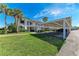 Two-story condo building with carport parking and lush landscaping at 4366 Madeira Ct # 3356, Sarasota, FL 34233