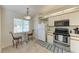 Bright kitchen features stainless steel appliances and breakfast nook at 4366 Madeira Ct # 3356, Sarasota, FL 34233
