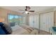 Spacious bedroom with water views and sliding glass doors at 4600 Gulf Of Mexico Dr # 206, Longboat Key, FL 34228