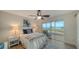 Bedroom with water views and sliding glass doors to balcony at 4600 Gulf Of Mexico Dr # 206, Longboat Key, FL 34228