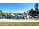 Several boats and jet skis are docked at the waterside at 4600 Gulf Of Mexico Dr # 206, Longboat Key, FL 34228