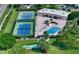 Aerial view of community pool, tennis courts, shuffleboard at 4600 Gulf Of Mexico Dr # 206, Longboat Key, FL 34228
