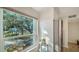 Bright kitchen features white cabinets, stainless steel appliances, and a view of the outdoors at 4600 Gulf Of Mexico Dr # 206, Longboat Key, FL 34228