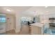 Modern kitchen with white cabinets, quartz countertops, and stainless steel appliances at 4600 Gulf Of Mexico Dr # 206, Longboat Key, FL 34228