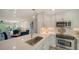 Modern kitchen with stainless steel appliances and white cabinets at 4600 Gulf Of Mexico Dr # 206, Longboat Key, FL 34228