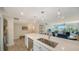 Open concept kitchen boasts a large island with quartz countertops and a breakfast bar at 4600 Gulf Of Mexico Dr # 206, Longboat Key, FL 34228