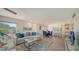 Bright living room with comfy sofas and modern decor at 4600 Gulf Of Mexico Dr # 206, Longboat Key, FL 34228