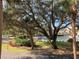 Community pool area with lush landscaping and trees at 4600 Gulf Of Mexico Dr # 206, Longboat Key, FL 34228