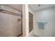 Large walk-in shower with neutral tile, glass block window, and modern showerhead at 4600 Gulf Of Mexico Dr # 206, Longboat Key, FL 34228