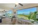 Bright sunroom with water views and comfortable seating at 4600 Gulf Of Mexico Dr # 206, Longboat Key, FL 34228