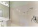Bathroom with walk-in shower, tiled walls, and modern fixtures at 4716 Foxtail Dr, Parrish, FL 34219