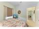 Guest bedroom with a comfortable bed and view of hallway at 4716 Foxtail Dr, Parrish, FL 34219