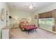 Comfortable bedroom with ceiling fan and large window at 4716 Foxtail Dr, Parrish, FL 34219